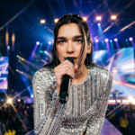Dua Lipa performing live on Radical Optimism World Tour 2026 - High-resolution real face stage photo