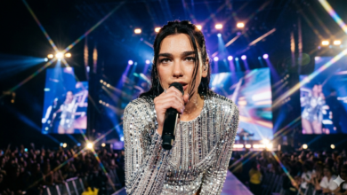 Dua Lipa performing live on Radical Optimism World Tour 2026 - High-resolution real face stage photo