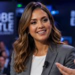 Jessica Alba speaking on stage at a business event, Jessica Alba net worth 2026