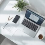 Laptop showing an AI resume builder tool on a clean desk, illustrating the best AI resume builders for job seekers.